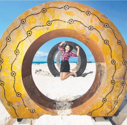  ?? Picture: NIGEL HALLETT ?? Philippa Arrowsmith poses with the sculpture ‘Embryo’ at the Swell Festival which starts tomorrow.