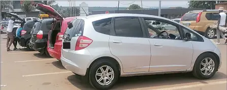  ?? (Pic: Melisa Msweli) ?? Some of the illegal taxis that are operating in Nhlangano town. Worth noting is that legal taxis have brown ink registrati­on numbers, among other things.