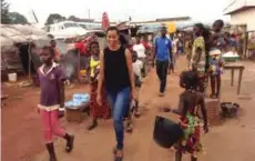  ??  ?? Pascale Serra, film-maker, walking through the MíPoko Airport displaced persons’ camp in Bangui, Central African Republic. —Reuters