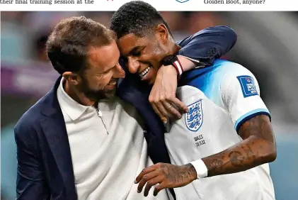  ?? AFP ?? That’s my boy: Southgate embraces Rashford after his substituti­on and standout performanc­e