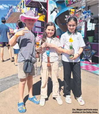  ?? ?? Zac, Megan and Katie enjoy slushies at the Dalby Show.