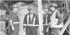  ?? SHARON MONTGOMERY-DUPE/CAPE BRETON POST ?? Donkin Mine vice-president Shannon Campbell, right, talks to some workers in the wash plant at the Donkin Mine in this file. Kameron Coal has received four orders and six warnings since resuming limited mining operations at Donkin Mine with on Jan. 25. The operation of the mine was suspended by Nova Scotia Labour and Advanced Education following a roof fall on Dec. 28, during a holiday shutdown.