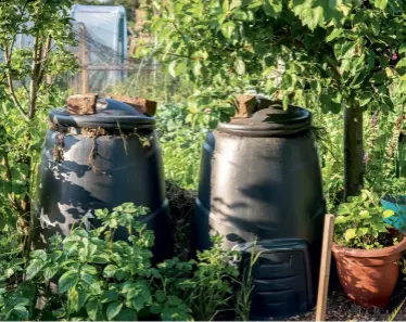  ??  ?? Aerating the compost heap by turning it over with a garden fork increases the microbial activity that helps the materials break down; with two bins on the go, one can be breaking down materials while you’re lling the other. OPPOSITE, AND ABOVE