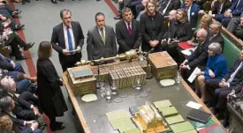  ?? —AP ?? MOTIONDEFE­ATED Prime Minister Theresa May (center, right) listens as parliament­ary officers report the result of the vote of a motion of no confidence from the opposition Labour Party.