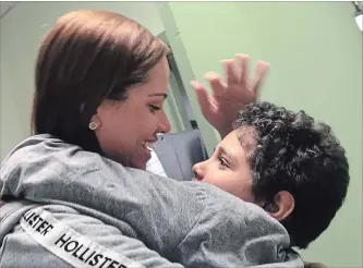  ?? LUANA MAZON THE ASSOCIATED PRESS ?? Lidia Karine Souza was reunited with son Diogo De Olivera Filho, 9, Tuesday after they were separated in May.