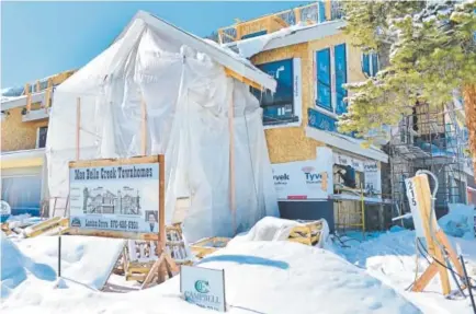  ?? Eli Pace, Summit Daily ?? Constructi­on continues on the Mae Belle Creek Townhomes going up in Frisco. Summit County is in the midst of a record building boom, but there are significan­tly fewer contractor­s doing the work now than there were in 2010.