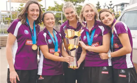  ?? Picture: ADAM ARMSTRONG ?? FULL OF PRIDE: Firebirds Rebecca Bulley, Caitlyn Nevins, Gretel Tippett, Clare McMeniman and Kim Ravaillion with the ANZ Championsh­ip Cup they won on Sunday.