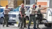  ?? Austin Dave/The Signal ?? Santa Clarita Valley deputies surround an older model Winnebago recreation­al vehicle in the Crossroads Shopping Center parking lot outside the Pei Wei restaurant near the intersecti­on of McBean Parkway and Valencia Boulevard. The RV was the focus of a reported attempted kidnapping a few blocks away.