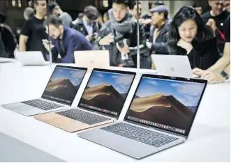  ?? BEBETO MATTHEWS/AP ?? Apple unveils new MacBook Air laptops Tuesday during the company’s showcase of new products in New York City. The device now has a high-resolution screen, with a higher starting price of US$1,200.