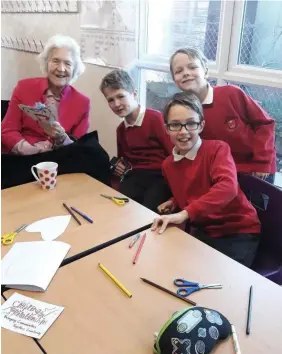  ??  ?? CHALLENGE: Moat House resident Pauline enjoys a Crafting Relationsh­ips creative session with pupils from Battling Brook Primary School, Hinckley