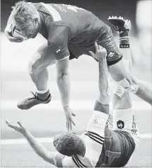  ?? CANADIAN PRESS FILE PHOTO ?? Canada’s Harry Jones, top, collides with France’s Thibauld Mazzoleni while running with the ball during World Rugby Sevens Series action in Vancouver on March 11.