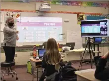  ?? IMAGE FROM SCREENSHOT ?? An elementary school teacher in the North Penn School District conducts a hybrid learning class.