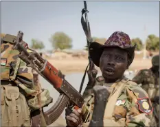  ??  ?? In this 2014 file photo, a South Sudanese government soldier chants in celebratio­n after government forces on Friday retook from rebel forces the provincial capital of Bentiu, in Unity State, South Sudan. AP PhoTo/MAckenzIe knowleS-couRSIn