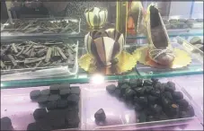  ??  ?? In addition to cakes, cookies, gelato and pastries, Aux Petits Delices offers hand crafted chocolate candy and bon bons which can be purchased in store or customized to a customer’s design.