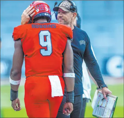  ?? Las Vegas Review-journal @Left_eye_images ?? L.E. Baskow
UNLV running back Aidan Robbins is congratula­ted by coach Marcus Arroyo after one of his three touchdowns against North Texas on Saturday at Allegiant Stadium. The Rebels won 58-27.