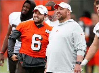  ?? AP PHOTO/RON SCHWANE ?? In this June 4 file photo, Cleveland Browns quarterbac­k Baker Mayfield (6) talks with coach Freddie Kitchens at the team’s NFL football training facility in Berea, Ohio.