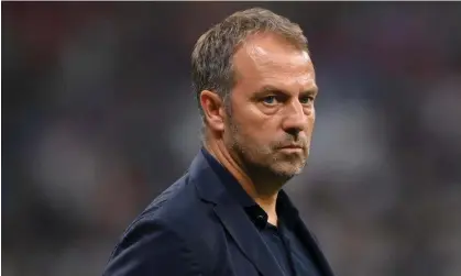  ?? ?? Hansi Flick watches from the sidelines during Germany’s ultimately futile victory against Costa Rica. Photograph: Shaun Botterill/Fifa/ Getty Images