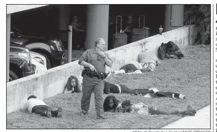  ?? AP/South Florida Sun-Sentinel/MIKE STOCKER ?? First responders secure an area at the airport. Witnesses said they fled the terminal when shots rang out.