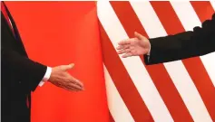  ??  ?? US and Chinese officials face a new round of tough trade talks yesterday as President Donald Trump discounted chances of a deal, but Beijing extended a potential olive branch. — Reuters photo