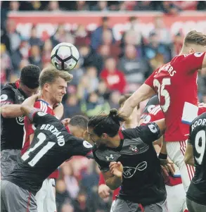  ??  ?? Patrick Bamford rises to head home Boro’s consolatio­n goal, before (right) celebratin­g wildly.