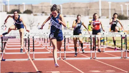 ?? MIKE SANDOVAL/FOR THE JOURNAL ?? La Cueva’s Sima Lucero crosses the finish line well ahead of her competitor­s, winning the 100-meter hurdles at Community Stadium