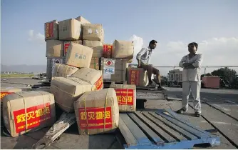 ?? NIRANJAN SHRESTHA/THE ASSOCIATED PRESS ?? Relief materials from China are piled at Tribhuvan Internatio­nal Airport in Kathmandu Sunday, where earthquake damage forced authoritie­s to close the runway to large aircraft delivering aid to millions.