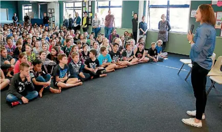  ?? PHOTO: MARK TAYLOR/FAIRFAX NZ ?? Olympic kayaker Lisa Carrington talks to Te Rapa Primary School pupils about her experience­s at the Rio Games.