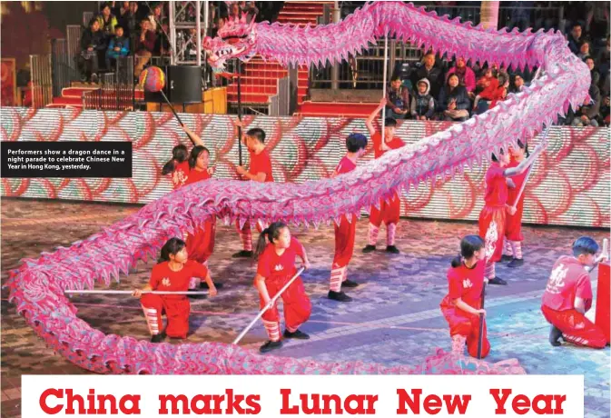  ??  ?? Performers show a dragon dance in a night parade to celebrate Chinese New Year in Hong Kong, yesterday.