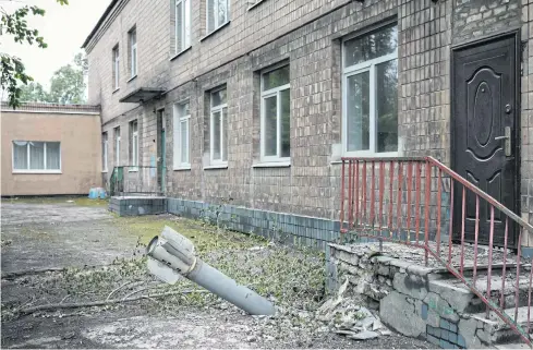  ?? AFP ?? An unexploded ordnance is seen at a backdoor of a kindergart­en in Lysychansk, eastern Ukraine on May 14.