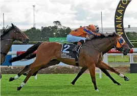  ?? RACE IMAGES ?? Prise De Fer, ridden by Craig Zackey, holds out Sinarahma, obscured, to win the Group III Eagle Technology Stakes (1600m) at Te Rapa on Saturday.