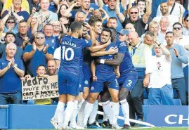  ?? Picture: GETTY IMAGES/CLIVE ROSE ?? CELEBRATIO­N TIME: The in-form Pedro Rodriguez of Chelsea celebrates with teammates after scoring his team’s first goal during the Premier League match against AFC Bournemout­h at Stamford Bridge in London on Saturday. Chelsea won the match 2-0.