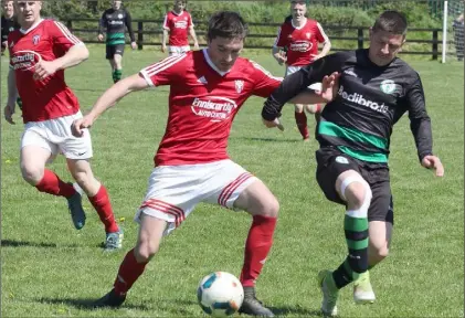  ??  ?? Eamon O’Brien of Shamrock Rovers closes in on Patrick O’Shea of Moyne Rangers during the Wexford Cup semi-final.