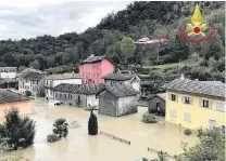  ?? PHOTO: VIGILI DEL FUOCO VIA REUTERS ?? Under water . . . A fire brigade helicopter carries out a rescue in Ornavasso, Italy, yesterday.