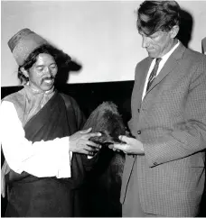  ??  ?? Edmund Hillary and Khunjo Chumbi holding the hairy scalp which, acording to Himalayan villagers, belonged to a Yeti