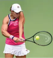  ?? — AFP ?? Ashleigh Barty of Australia hits a return against Petra Martic of Croatia during their women’s singles quarterfin­al match at the Wuhan Open on Thursday.