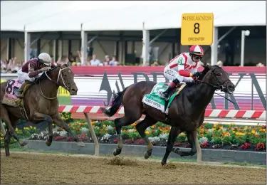  ?? Associated Press ?? Big winner: Jose Ortiz, right, atop Early Voting, heads to the finish line with Joel Rosario, atop Epicenter, at his tail before winning the 147th running of the Preakness Stakes Saturday in Baltimore.