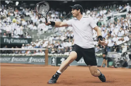  ??  ?? Andy Murray battles to victory against Japan star Kei Nishikori at Roland Garros yesterday.