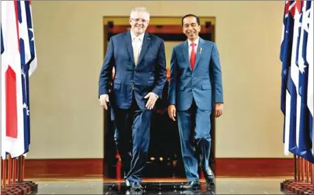  ?? AFP ?? Australian Prime Minister Scott Morrison (left) with Indonesian President Joko Widodo in Canberra on February 10.