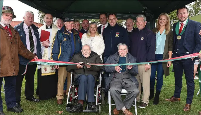  ??  ?? Honorary presidents Charlie Smith, Jimmy Brady, Jim McDonnell and Tony Craven, with Chairperso­n Paul Scanlon cut the ribbon to officially open the new dressing rooms at St Mary’s GFC Donore