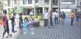  ??  ?? Residents outside Tata Amantra housing society in Bhiwandi on Saturday.