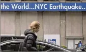  ?? YUKI IWAMURA/AP ?? A news bulletin about Friday’s earthquake is displayed at News Corp Headquarte­rs in New York City, which was rattled by the shocks.