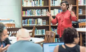  ??  ?? Comaneci Brooken, center, a client success partner with BrightByte­s, speaks during a training session for a new data system being deployed throughout Shelby County Schools this fall. BRAD VEST / THE COMMERCIAL APPEAL