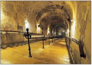  ??  ?? In Reims, France, Taittinger Champagne offers tours of its vast cellars dug deep undergroun­d into limestone quarries.