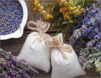  ??  ?? Lavender pouches, dried lavender and other herbs provide a heady fragrance