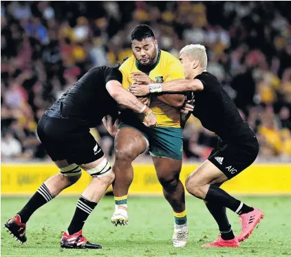  ?? PHOTO: GETTY IMAGES ?? Up the guts . . . All Blacks Sam Whitelock (left) and Rieko Ioane do their best to stop rampaging Wallaby replacemen­t prop Taniela Tupou during the Bledisloe Cup test at Suncorp Stadium in Brisbane on Saturday night.