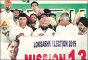  ??  ?? Punjab CM Captain Amarinder Singh and PPCC chief Sunil Jakhar release ‘Mission 13’ poster at Killianwal­i in Lambi assembly segment on Sunday. The poster marks the launch of the party’s Lok Sabha campaign in the state. SANJEEV KUMAR/HT