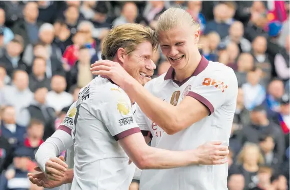  ?? Photo / AP ?? Kevin De Bruyne (left) and Erling Haaland were among the scorers as Manchester City won 4-2 at Crystal Palace.