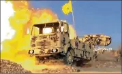  ?? SYRIAN CENTRAL MILITARY MEDIA VIA AP ?? A Hezbollah truck-mounted artillery piece blasts militant positions on the Lebanon-Syria border. The Syrian army and Lebanon’s Hezbollah launched the offensive Friday to remove militants.