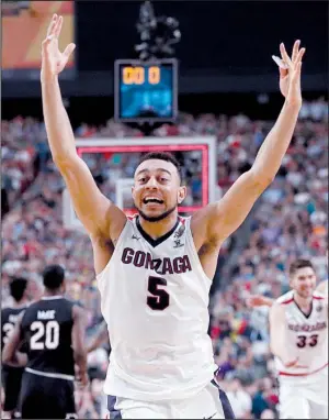  ?? AP/CHARLIE NEIBERGALL ?? Gonzaga’s Nigel Williams-Goss celebrates at the conclusion of the Bulldogs’ 77-73 victory over South Carolina on Saturday at the Final Four in Glendale, Ariz. Williams-Goss had 23 points as Gonzaga advanced to its first national title game.
