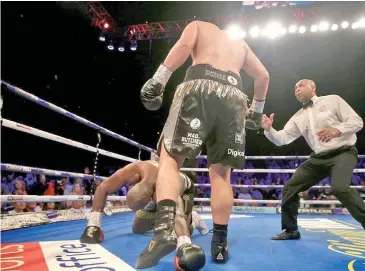  ?? Zimbio ?? Joseph Parker knocks Dillian Whyte down in the final round. White beat the count and held on to win on points at The O2 Arena in London, England on July 28, 2018..Photo: